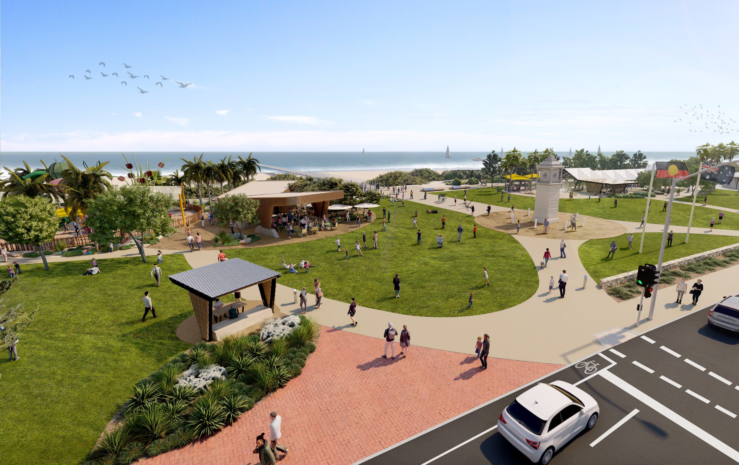 Grassed plaza space with wide paved paths. Monuments retained in current locations.