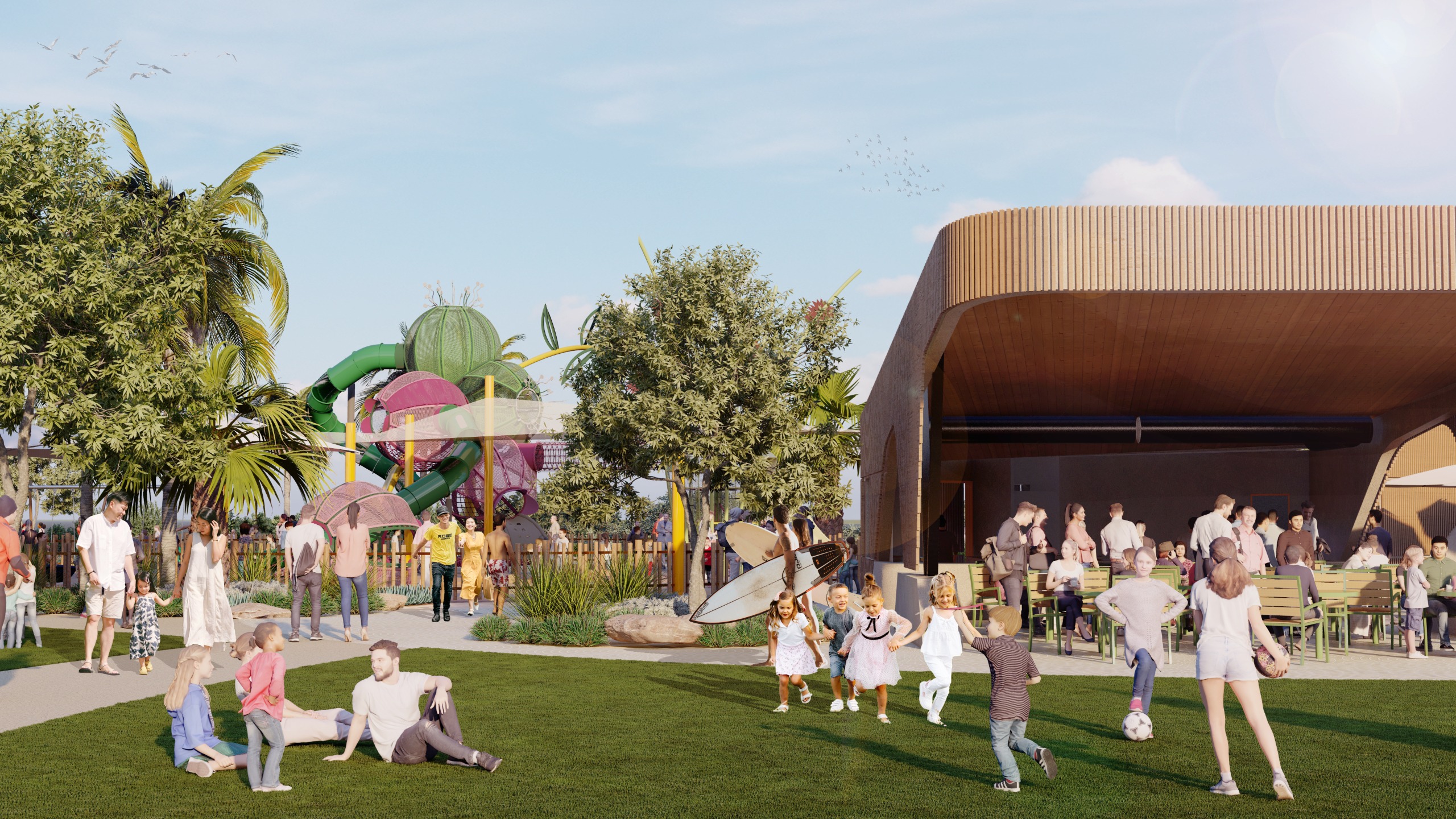Grassed area with food service kiosk and outdoor seating for eating.  Children's playground in background